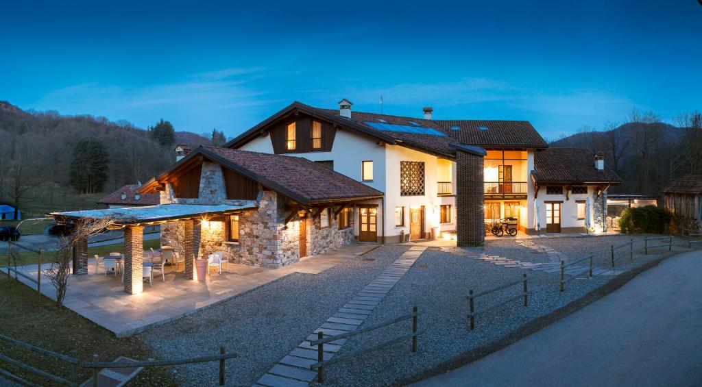 a large house with a pathway in front of it at La Burla in Borgosesia