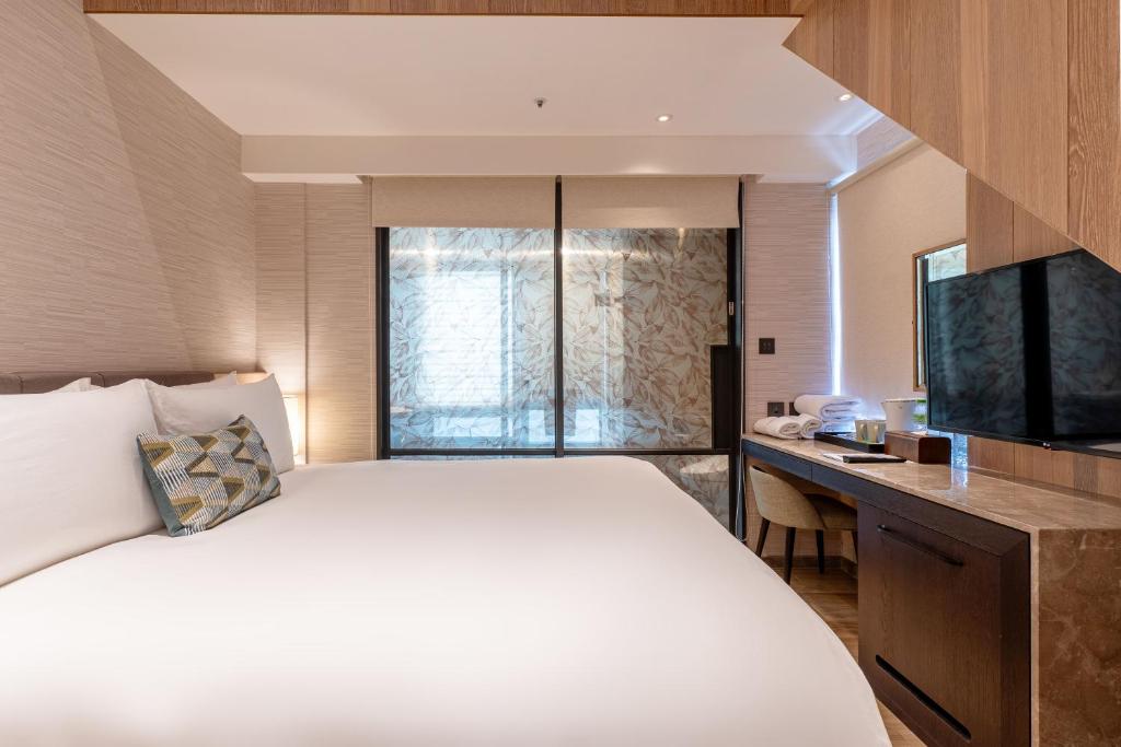 TV a/nebo společenská místnost v ubytování Kilin Hotel, JiaoXi