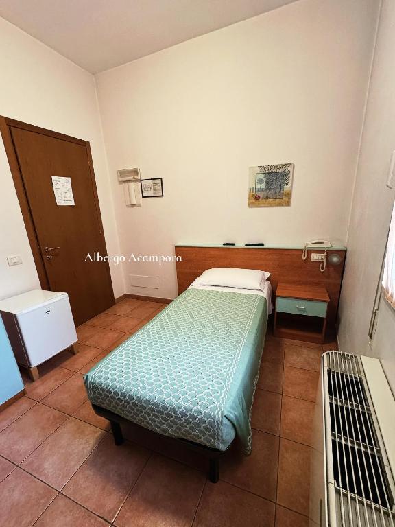 Postel nebo postele na pokoji v ubytování Albergo Acampora