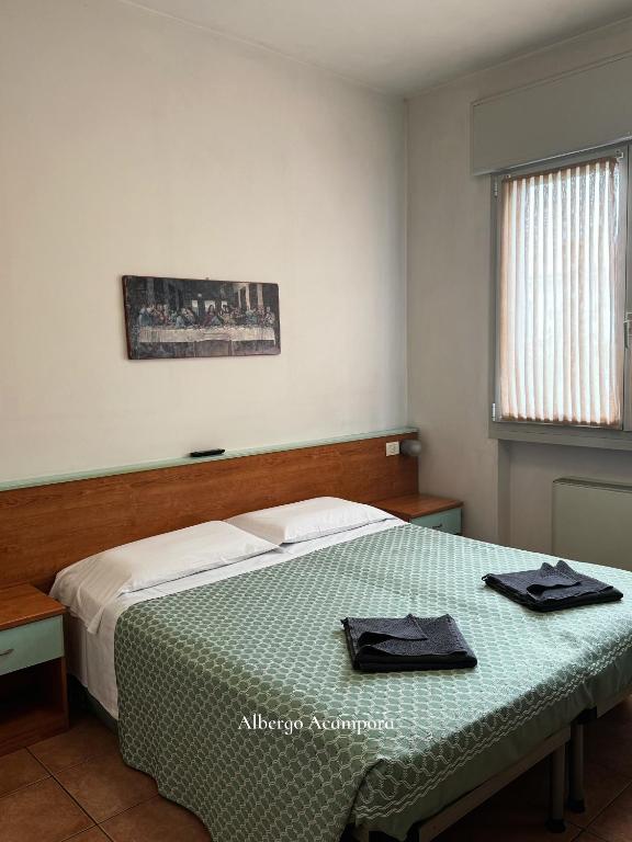 Postel nebo postele na pokoji v ubytování Albergo Acampora