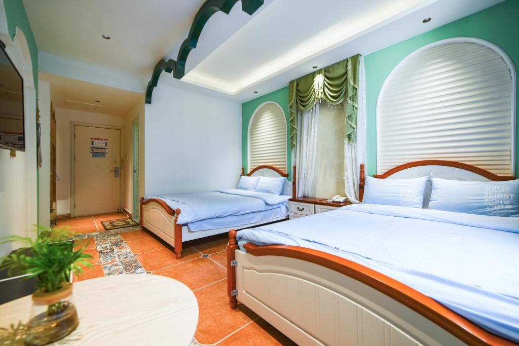 En eller flere senge i et værelse på Zhangjiajie Han Exotic Inn