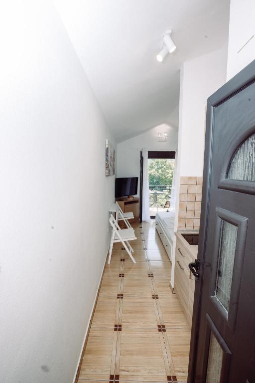 Uma televisão e/ou sistema de entretenimento em Zoi apartment