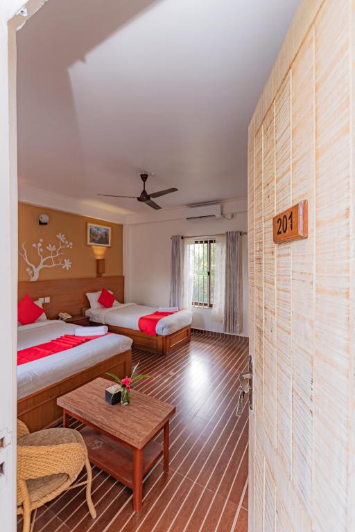 Katil atau katil-katil dalam bilik di Basundhara Resort Pokhara