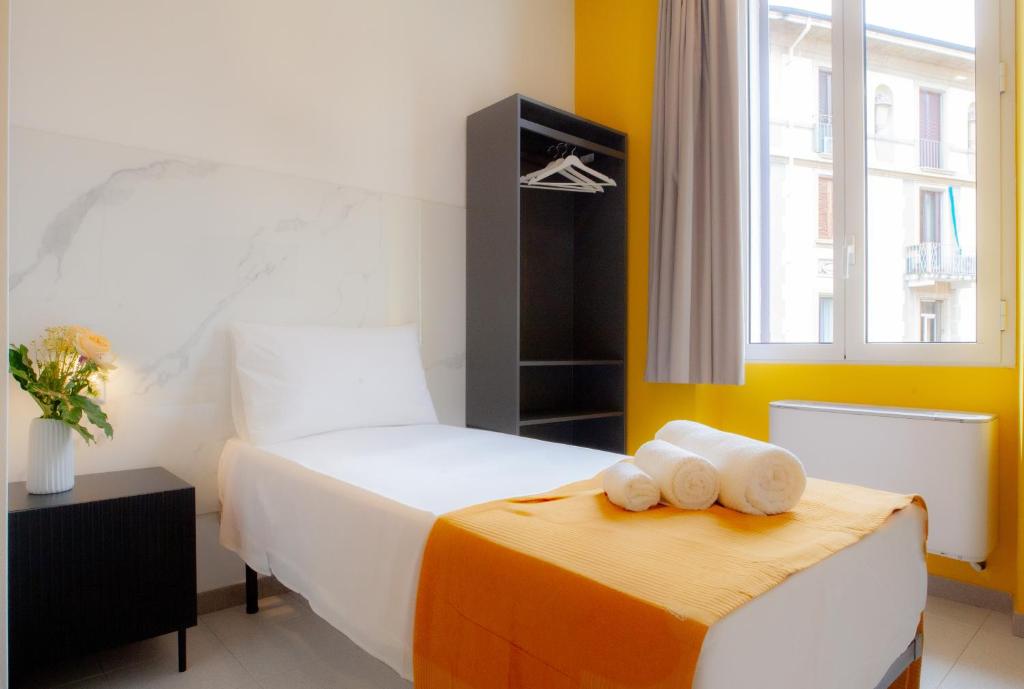 Postel nebo postele na pokoji v ubytování RRRapido Hotel
