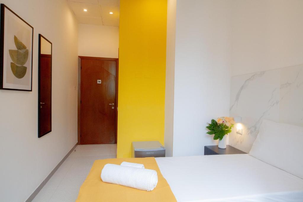 Postel nebo postele na pokoji v ubytování RRRapido Hotel