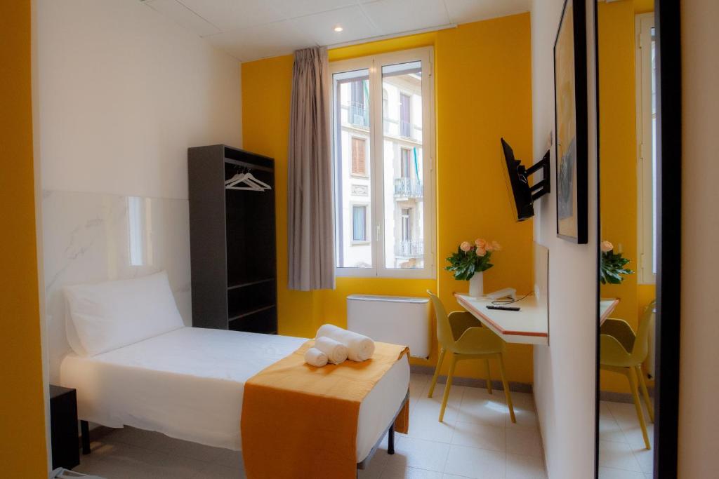 Postel nebo postele na pokoji v ubytování RRRapido Hotel