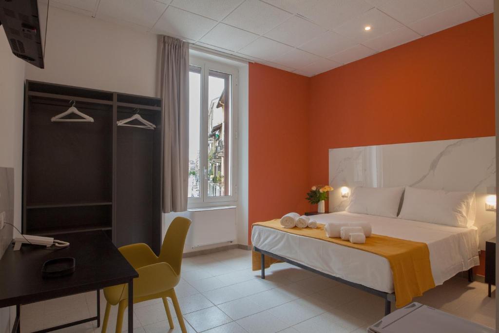 Postel nebo postele na pokoji v ubytování RRRapido Hotel