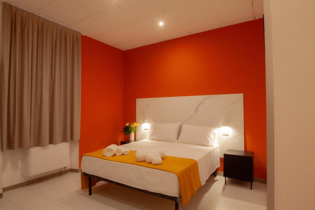 Postel nebo postele na pokoji v ubytování RRRapido Hotel