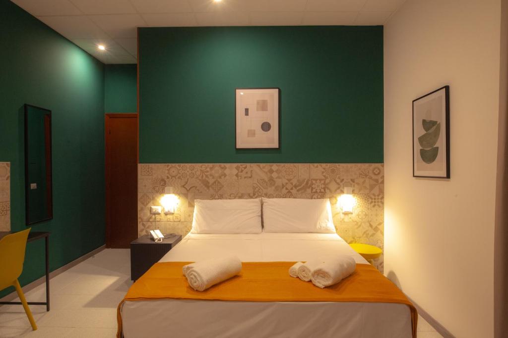 Postel nebo postele na pokoji v ubytování RRRapido Hotel