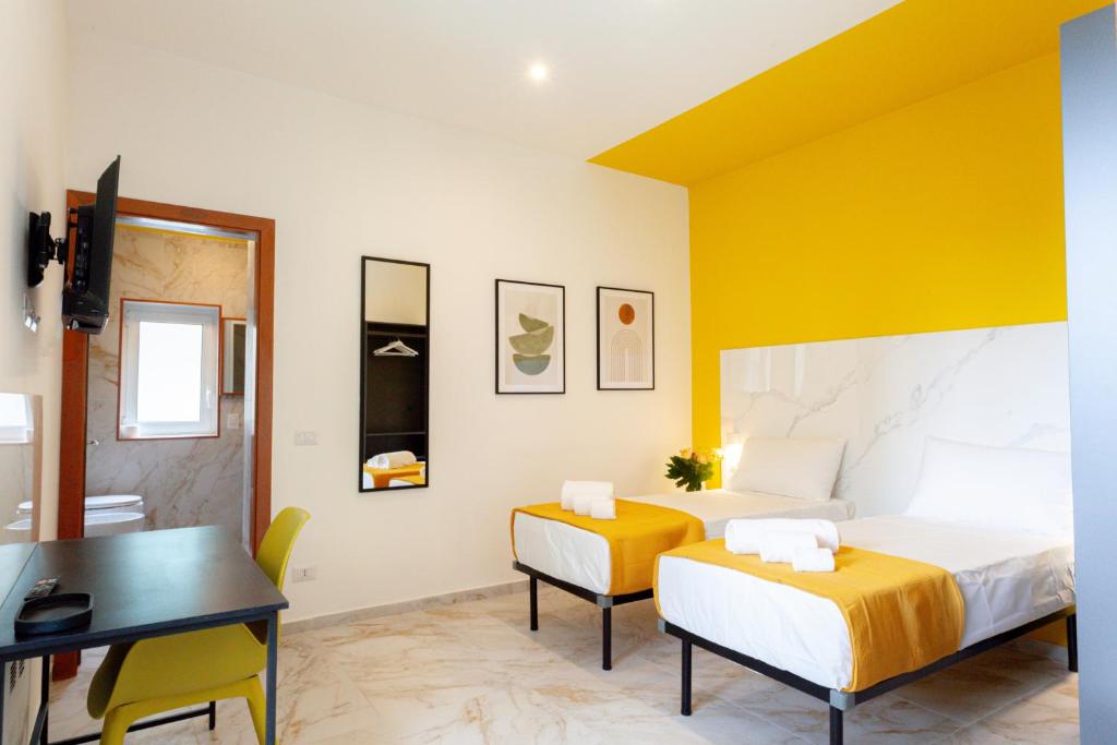 Postel nebo postele na pokoji v ubytování RRRapido Hotel