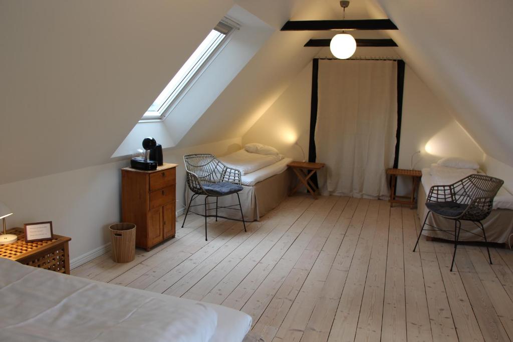 Postel nebo postele na pokoji v ubytování Bjerred B&B