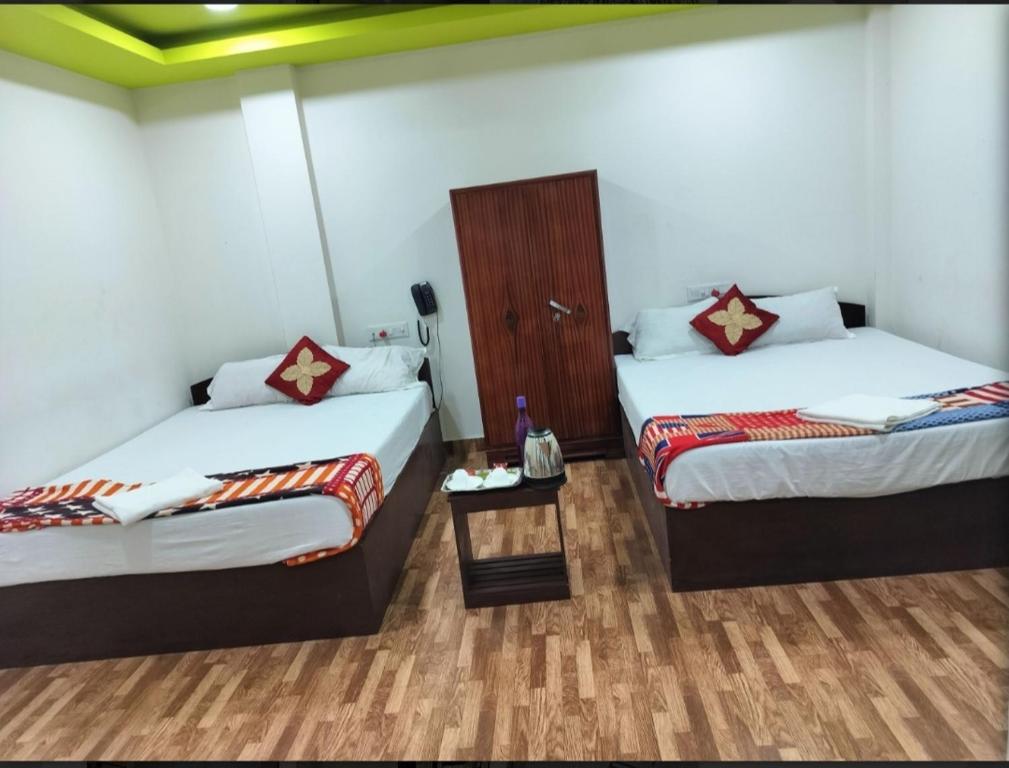 Postel nebo postele na pokoji v ubytování Kalapani homes