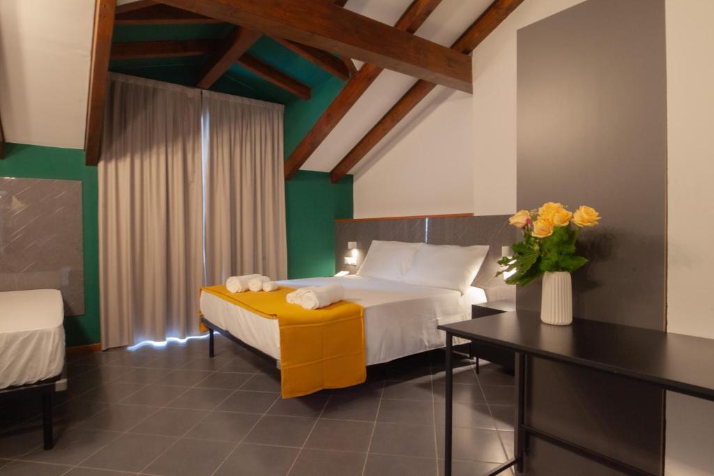 Postel nebo postele na pokoji v ubytování RRRapido Hotel