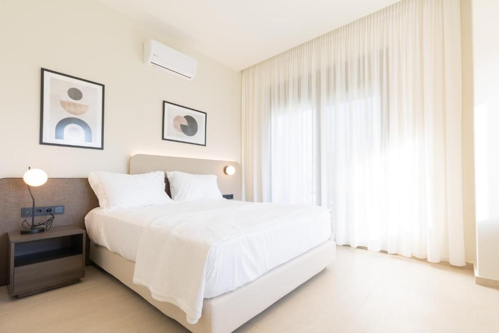 Postel nebo postele na pokoji v ubytování Palm View Suites