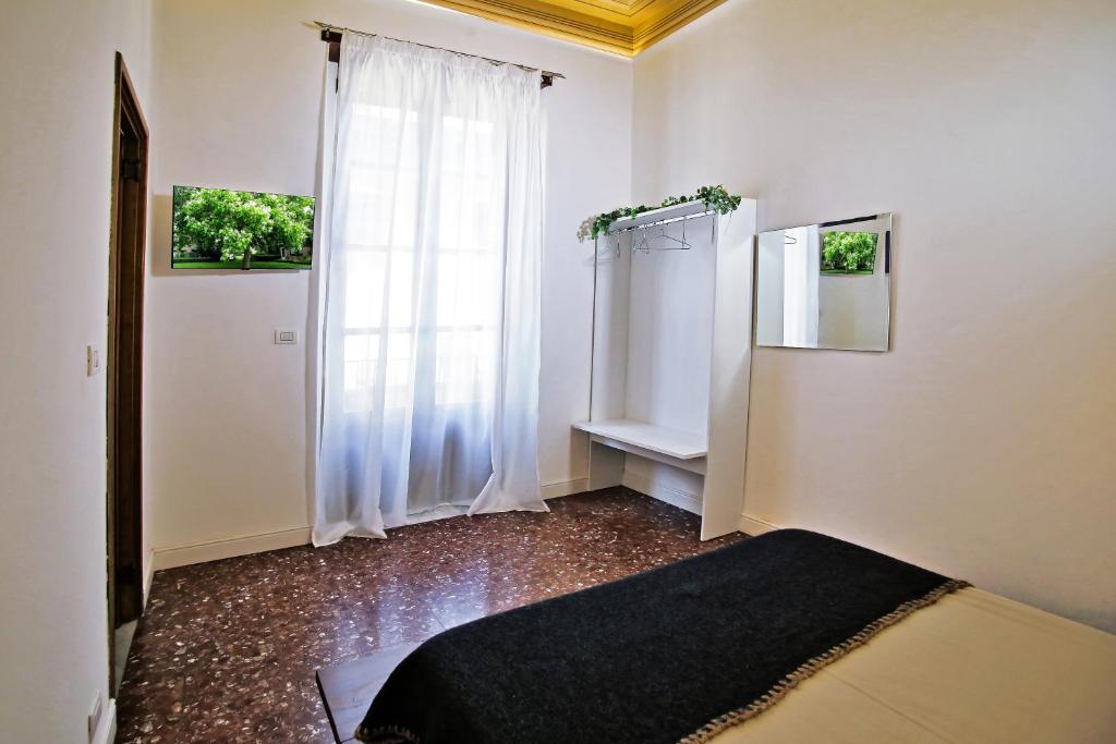 Postel nebo postele na pokoji v ubytování Tiritù Apartments