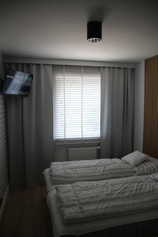 Postel nebo postele na pokoji v ubytování Apartament ARS Platinium Wisła-Spokojna