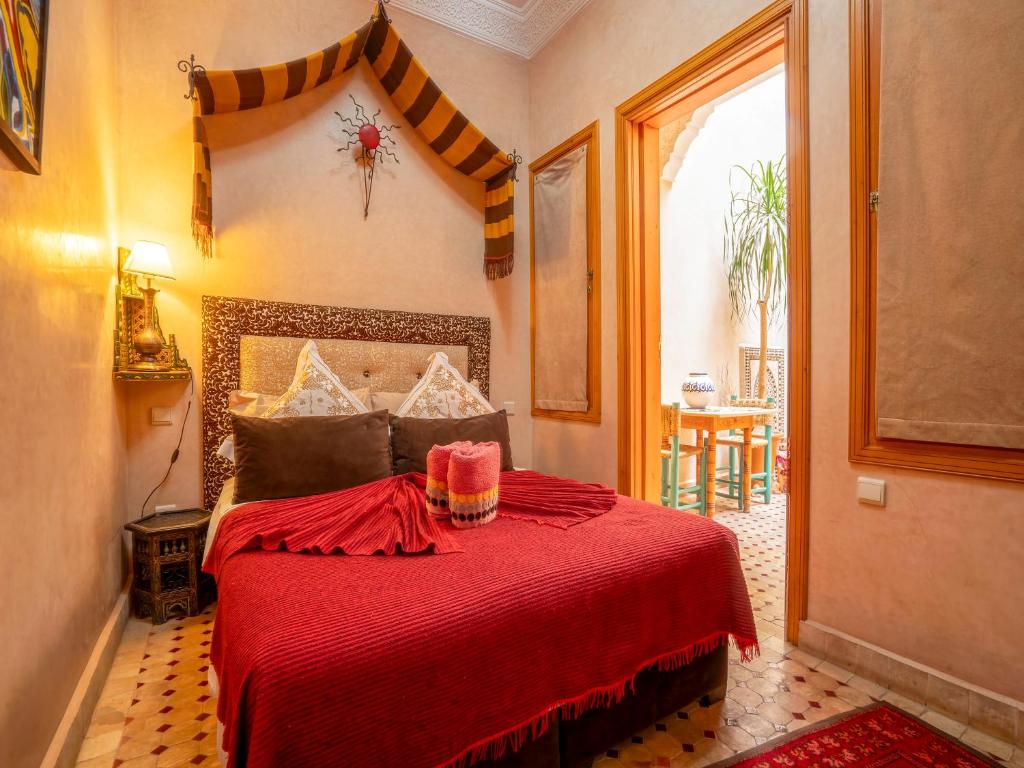 Postel nebo postele na pokoji v ubytování Riad Majdoulina chez JIJI
