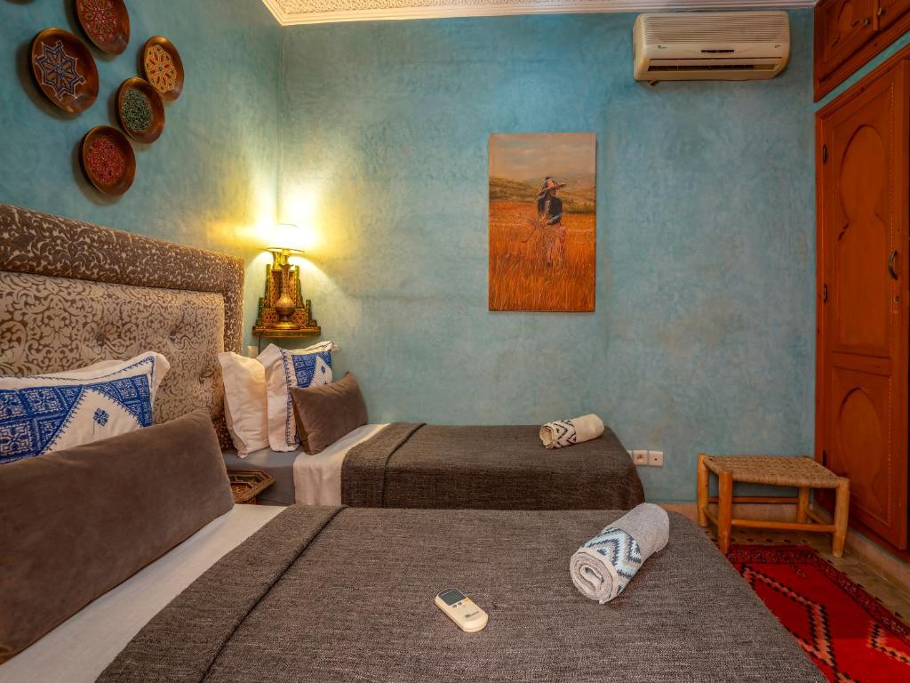 Postel nebo postele na pokoji v ubytování Riad Majdoulina chez JIJI