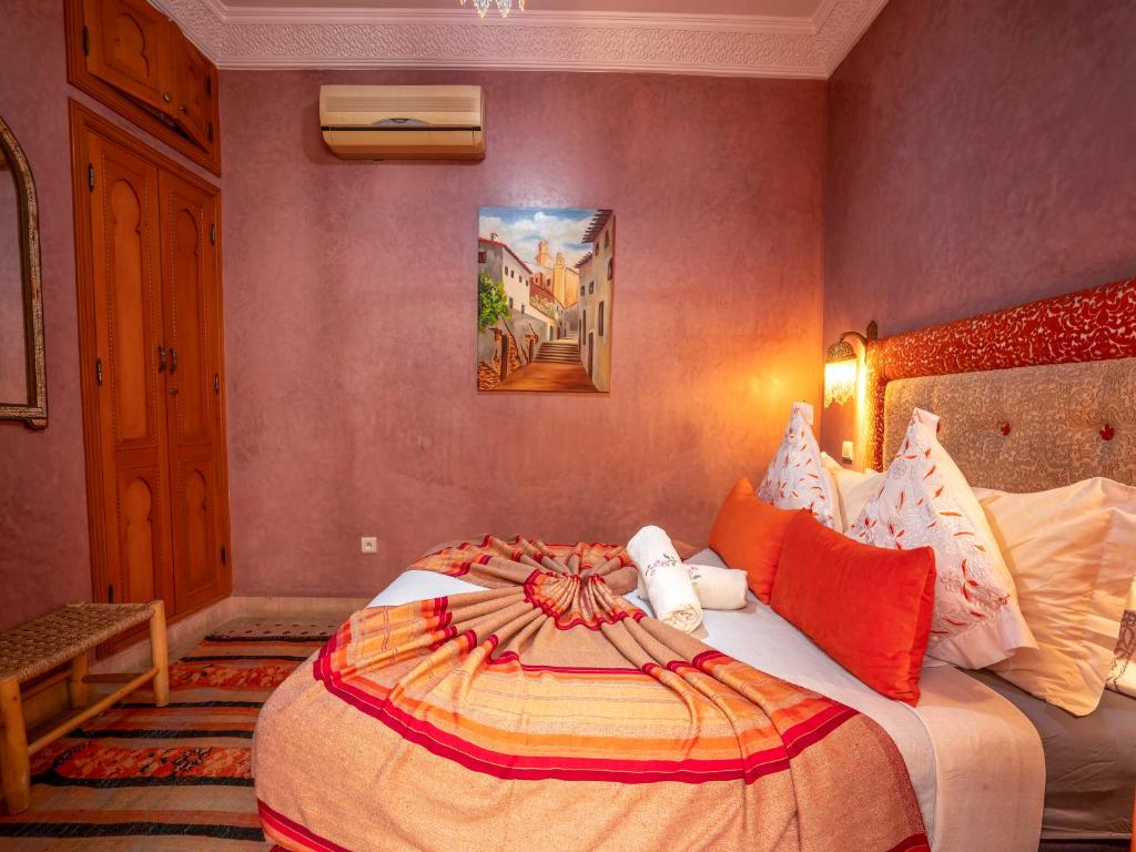 Postel nebo postele na pokoji v ubytování Riad Majdoulina chez JIJI