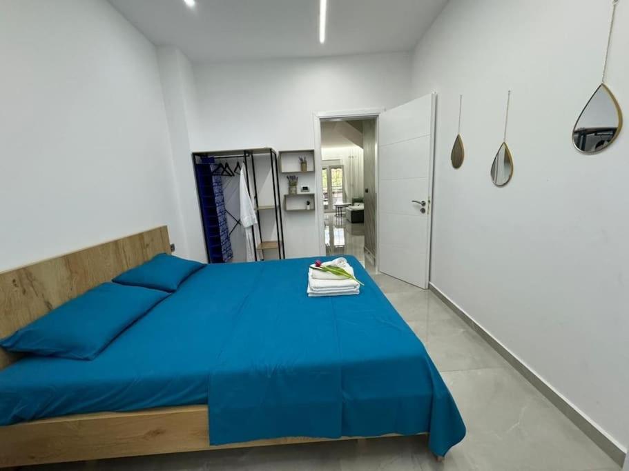 Postel nebo postele na pokoji v ubytování Duka Apartment