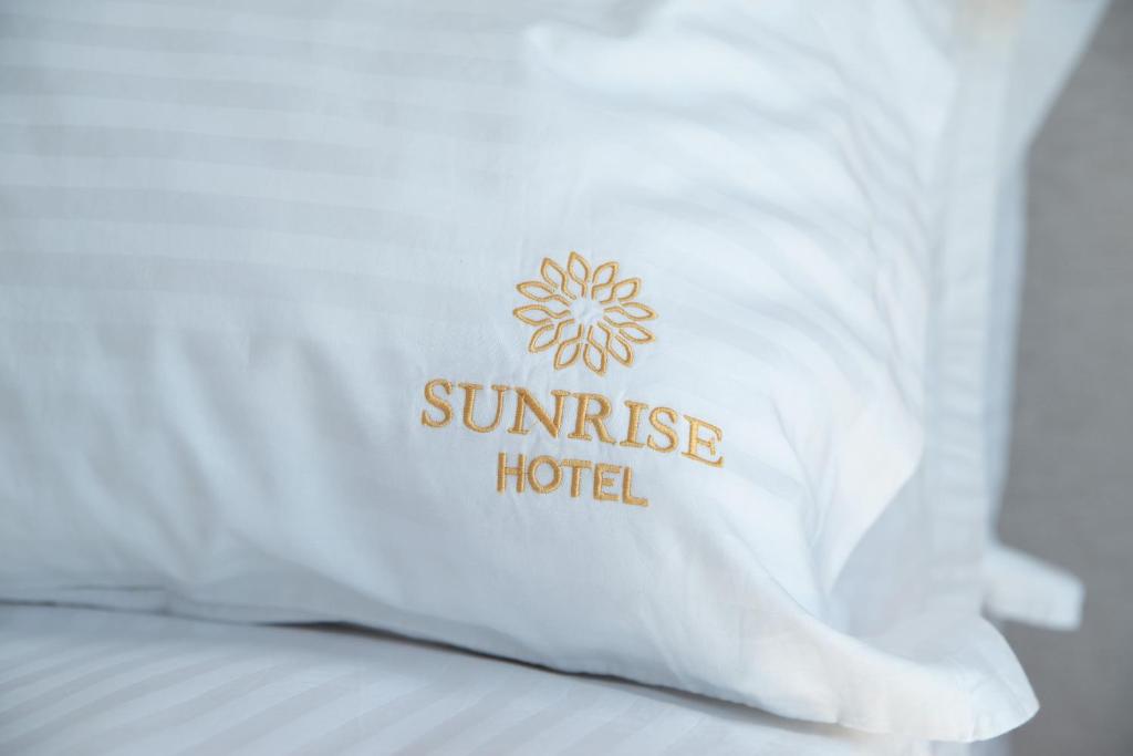 Postel nebo postele na pokoji v ubytování Sunrise Qeparo