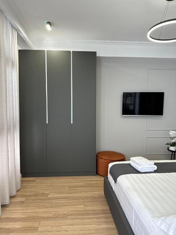 Postel nebo postele na pokoji v ubytování ABC Apartment Blloku Center