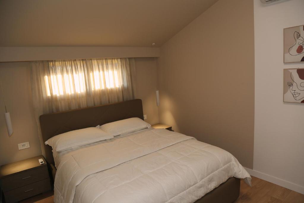 Postel nebo postele na pokoji v ubytování ABC Apartment Blloku Center