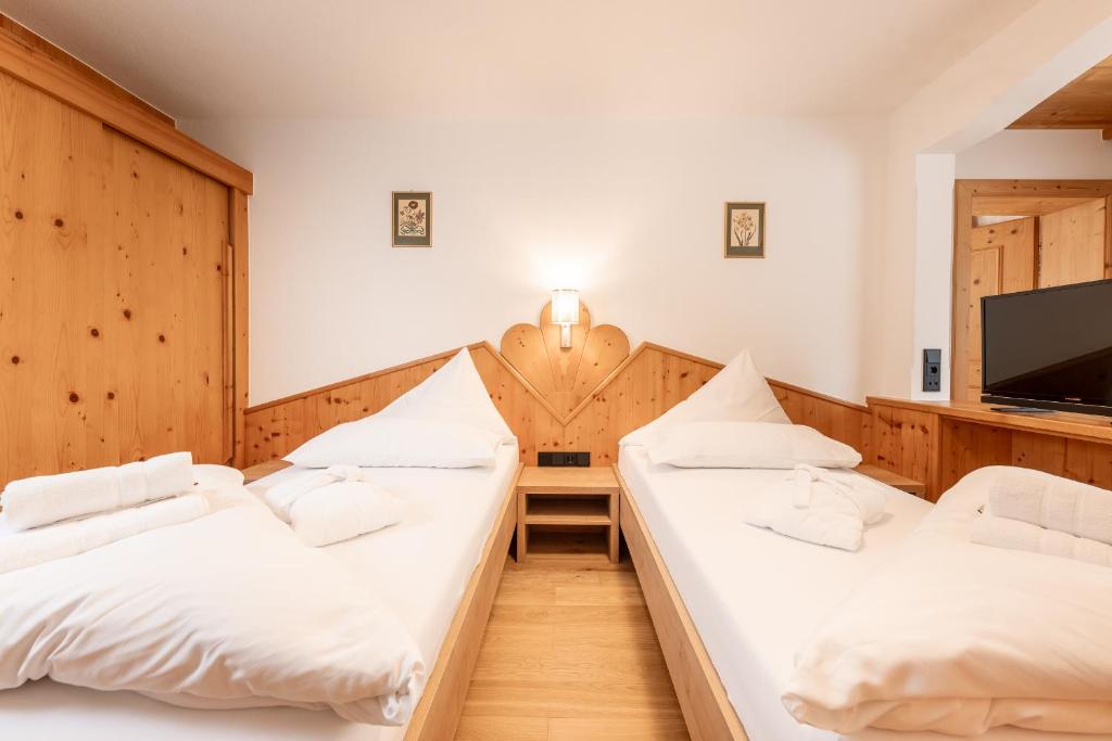 Postel nebo postele na pokoji v ubytování Hotel Berghof