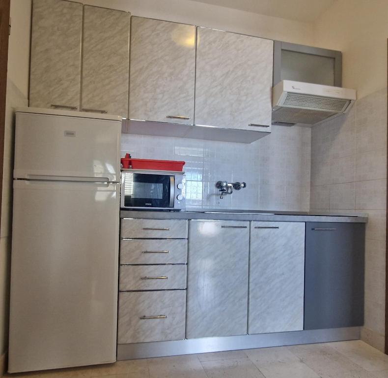 Kuchyň nebo kuchyňský kout v ubytování Apartments Vuksan