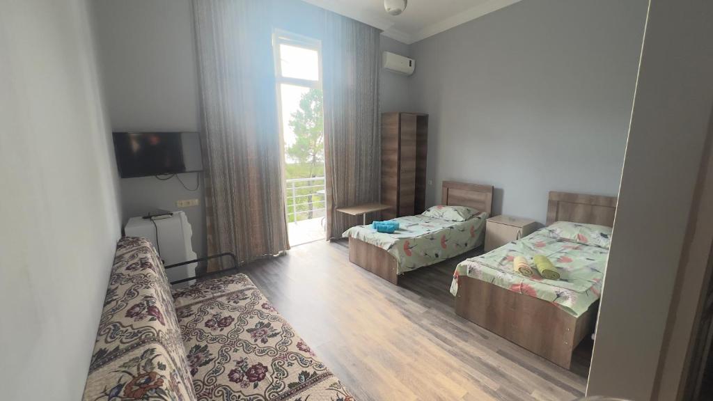 Postel nebo postele na pokoji v ubytování Grand Hotel Kobuleti