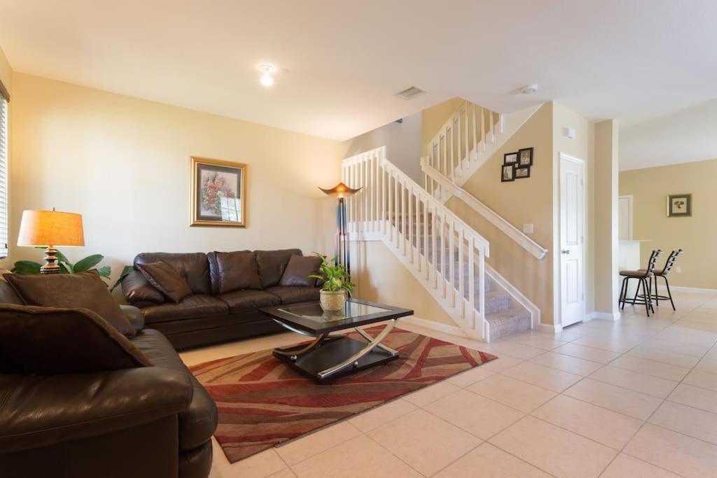 a living room with a couch and a table at Miami VACATION House Cribkeys in Homestead
