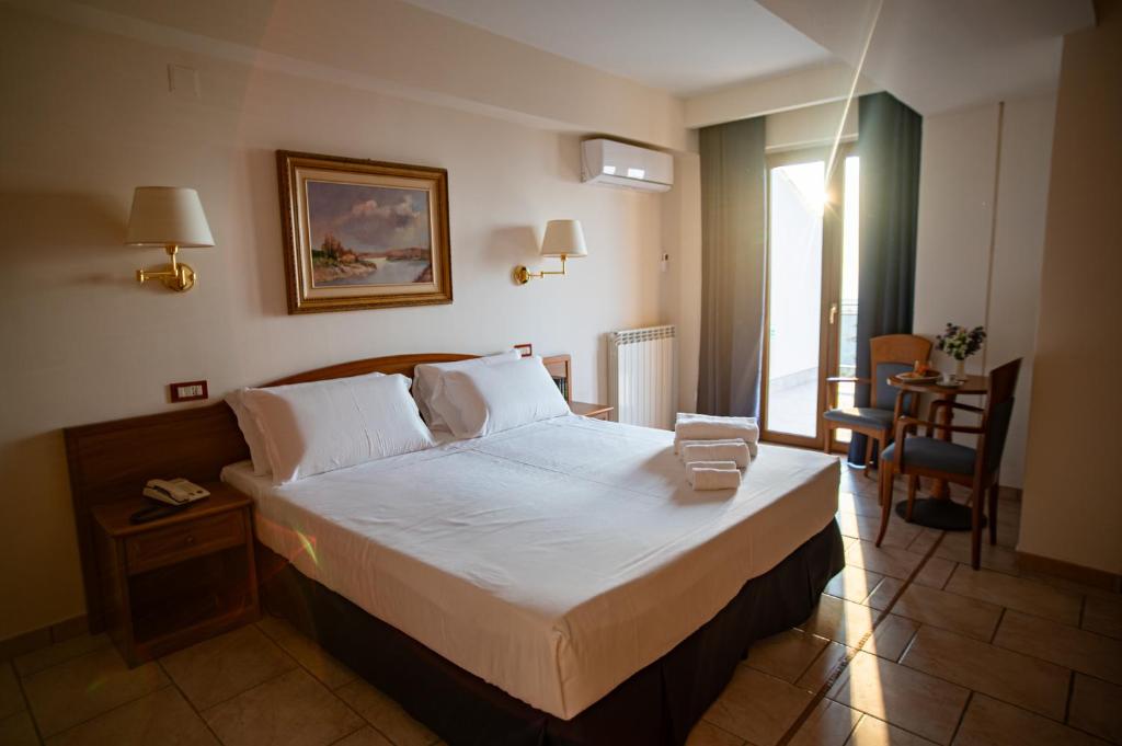 Postel nebo postele na pokoji v ubytování Hotel Bisanzio Resort