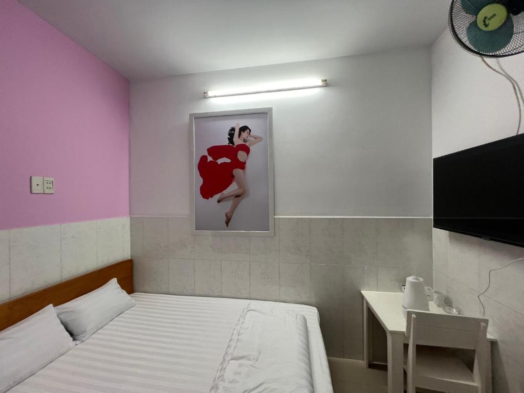Postel nebo postele na pokoji v ubytování Bin Hom Motel