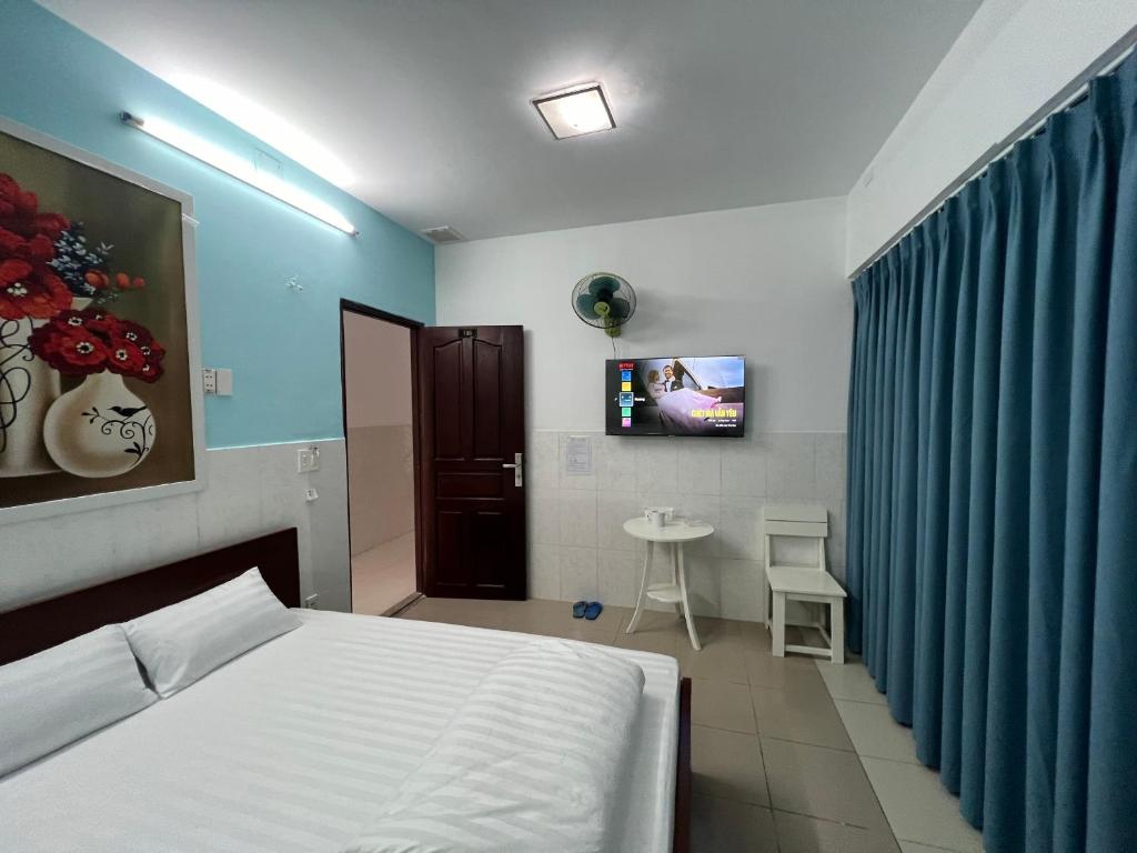 Postel nebo postele na pokoji v ubytování Bin Hom Motel