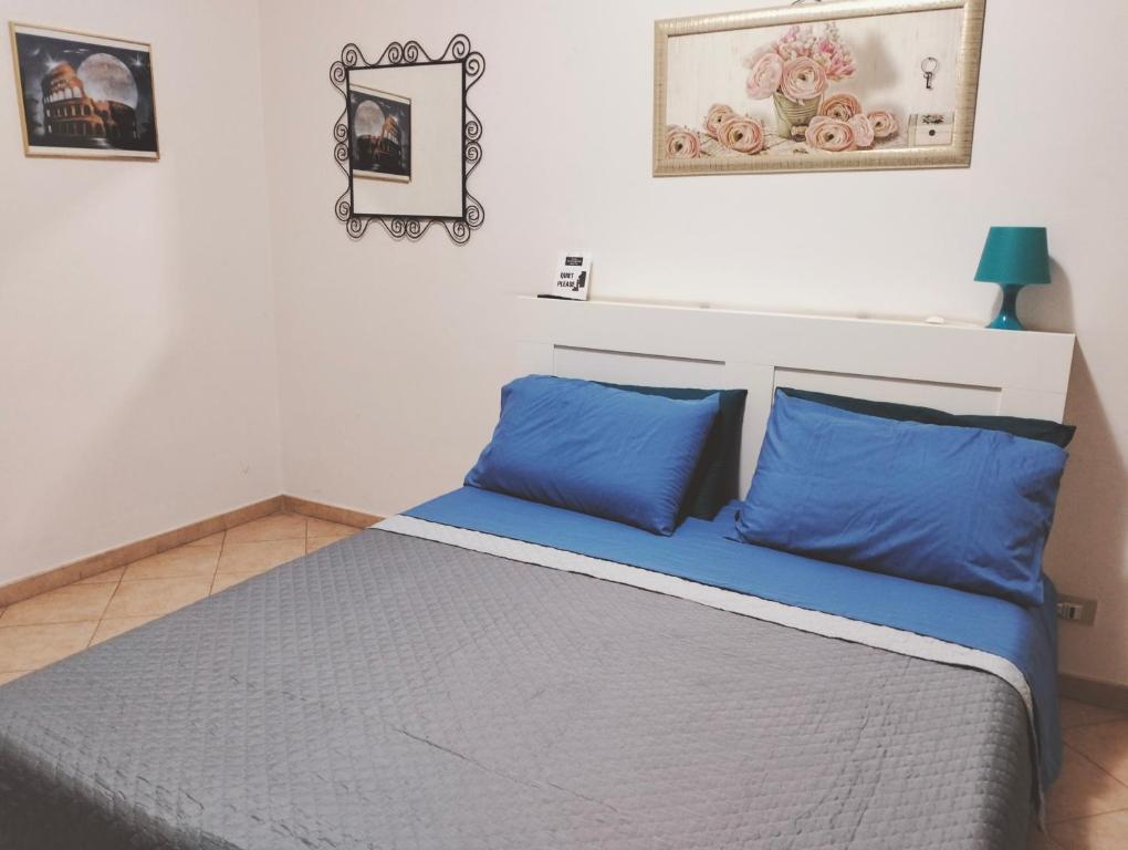 Łóżko lub łóżka w pokoju w obiekcie La Perla B & B