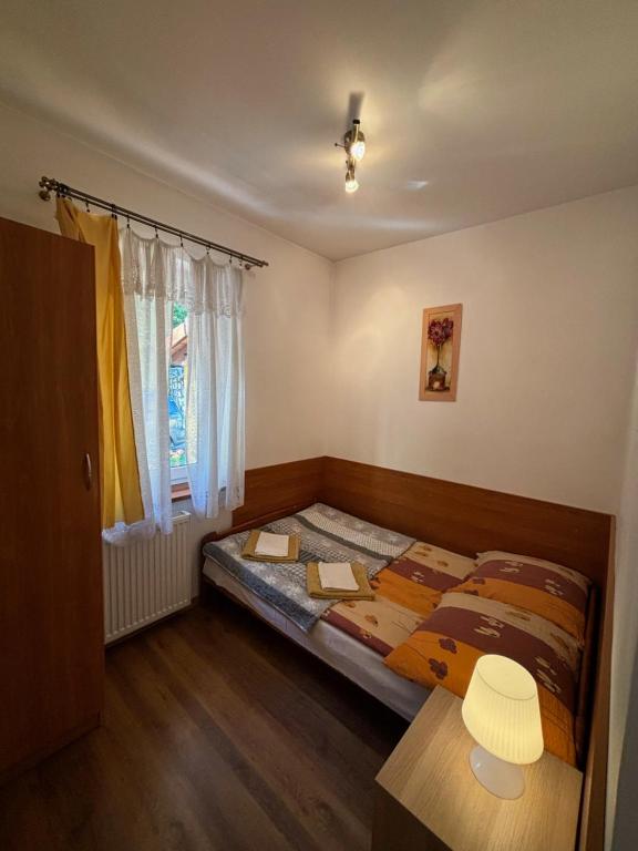Posteľ alebo postele v izbe v ubytovaní Panterej Pokoje Gościnne