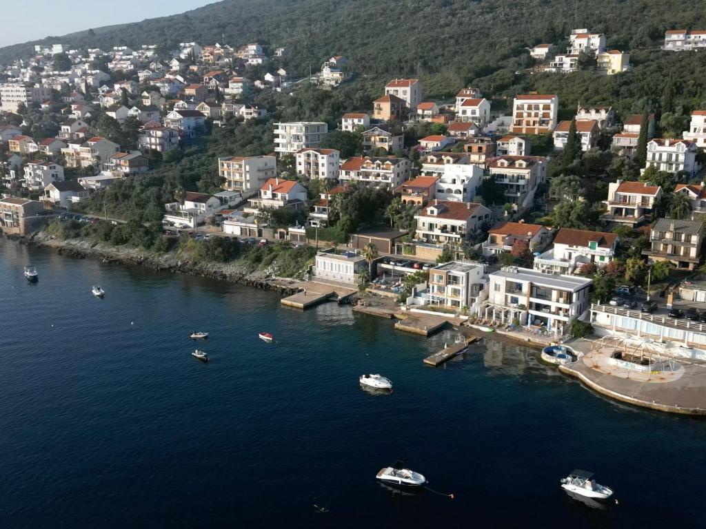 an aerial view of a city with boats in the water at Apartments Montevibe in Tivat