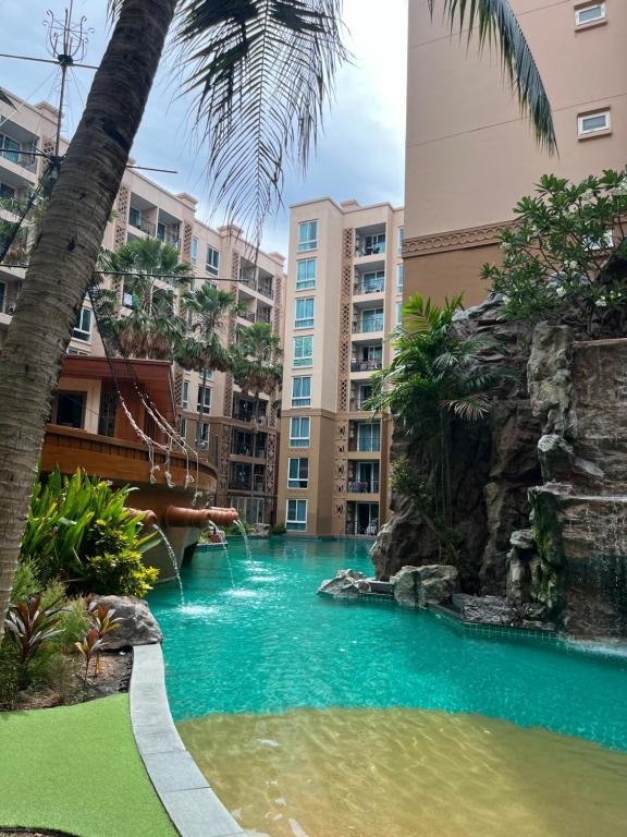 a water slide in the middle of a resort at Atlantis pattaya by ramita in Jomtien Beach