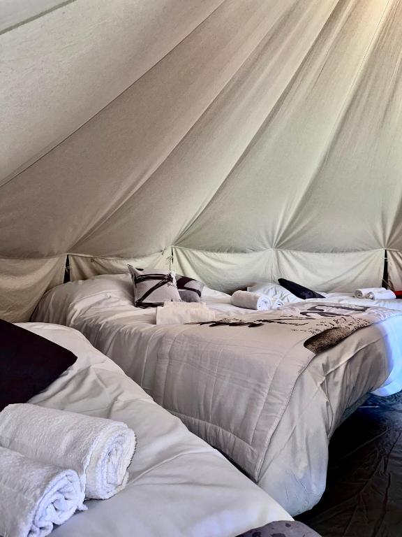 Posteľ alebo postele v izbe v ubytovaní village vacances du camboussel