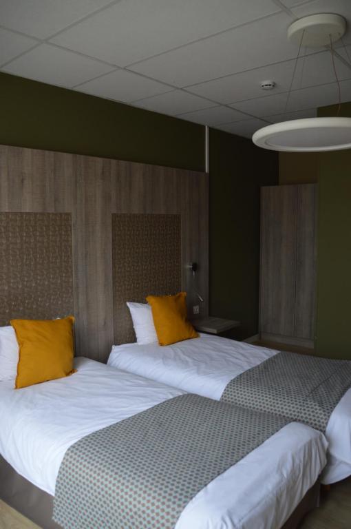 Postel nebo postele na pokoji v ubytování Hotel Mille Colonnes