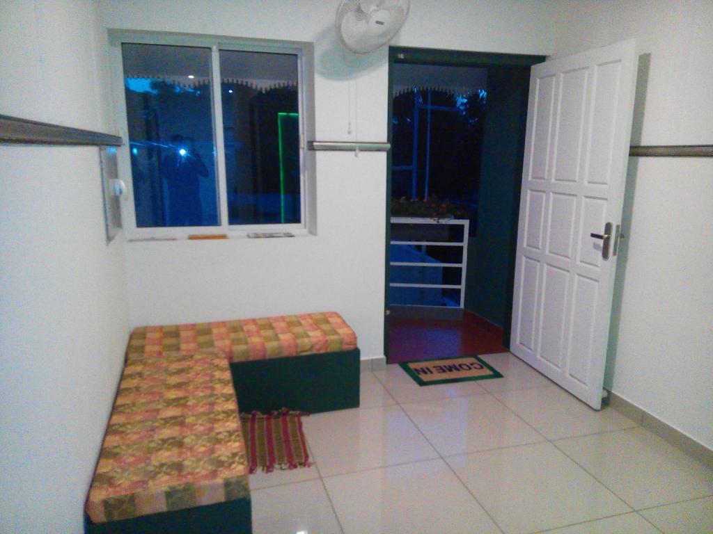 Postel nebo postele na pokoji v ubytování CL Dreams Homestay