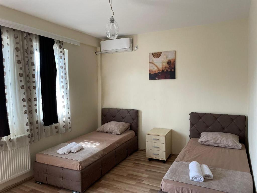 Postel nebo postele na pokoji v ubytování Hotel Balkan