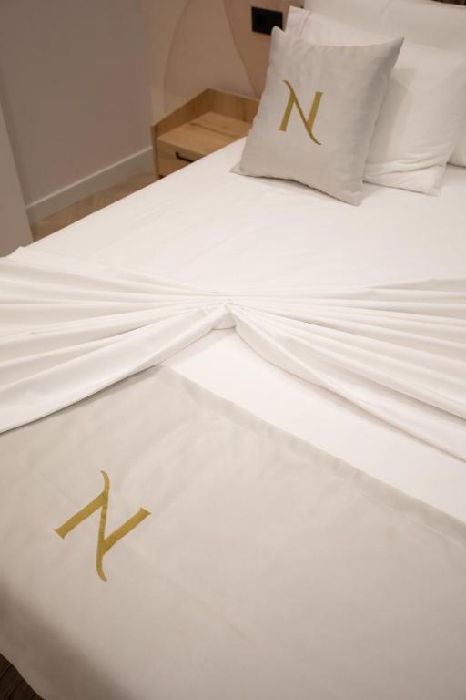 Postel nebo postele na pokoji v ubytování Nayel Hotel