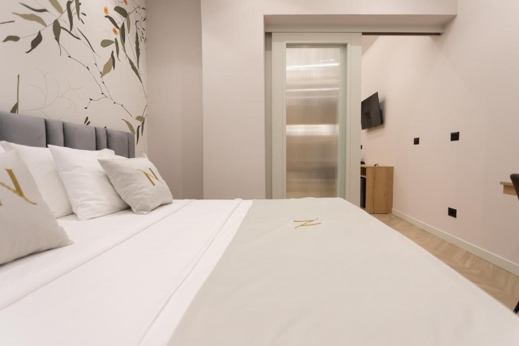 Postel nebo postele na pokoji v ubytování Nayel Hotel