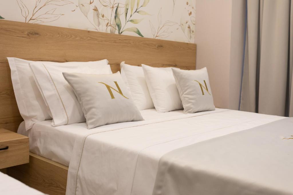 Postel nebo postele na pokoji v ubytování Nayel Hotel
