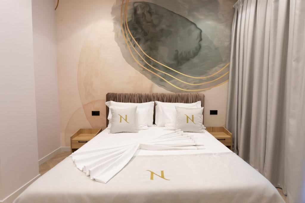 Postel nebo postele na pokoji v ubytování Nayel Hotel