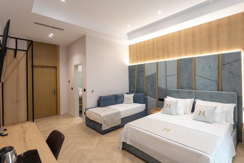 Postel nebo postele na pokoji v ubytování Nayel Hotel