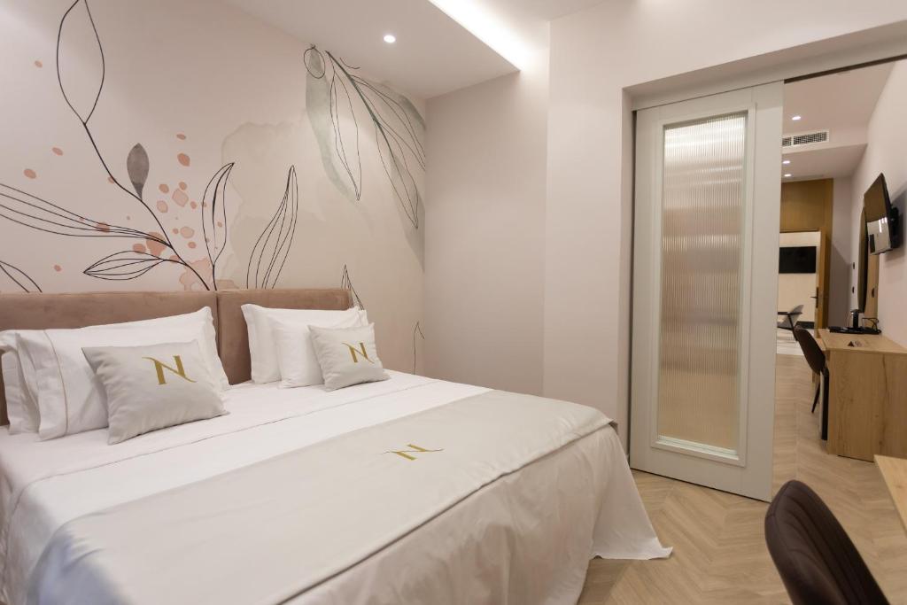 Postel nebo postele na pokoji v ubytování Nayel Hotel