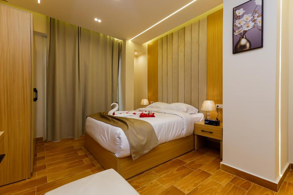 Postel nebo postele na pokoji v ubytování Rizk Pyramids View Hotel