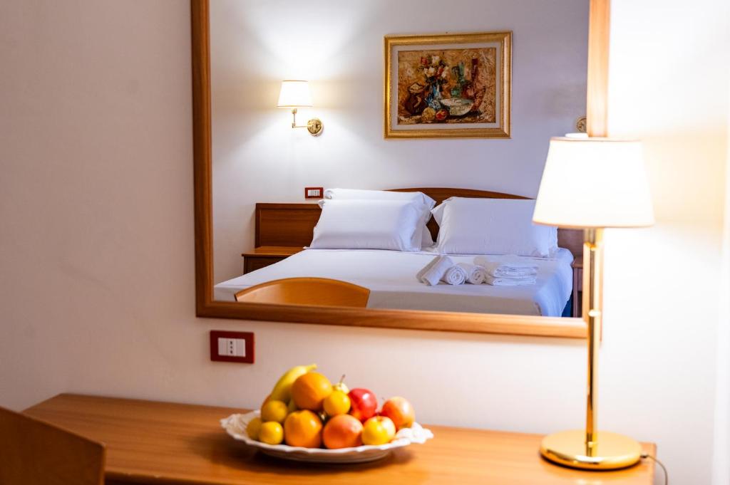 Postel nebo postele na pokoji v ubytování Hotel Bisanzio Resort